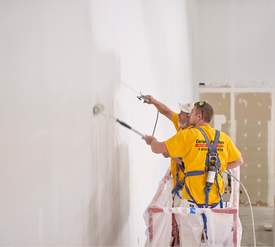 Warehouse interior painting by CertaPro team members
