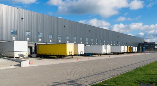 High Durability Coatings truck ramps behind warehouse