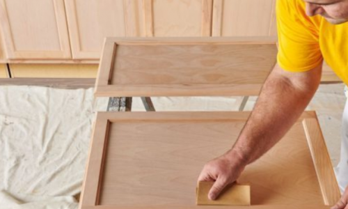 sanding and scraping cabinet