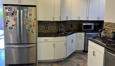 white kitchen cabinets with black counter tops