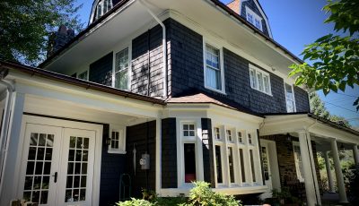 navy blue painted brick house