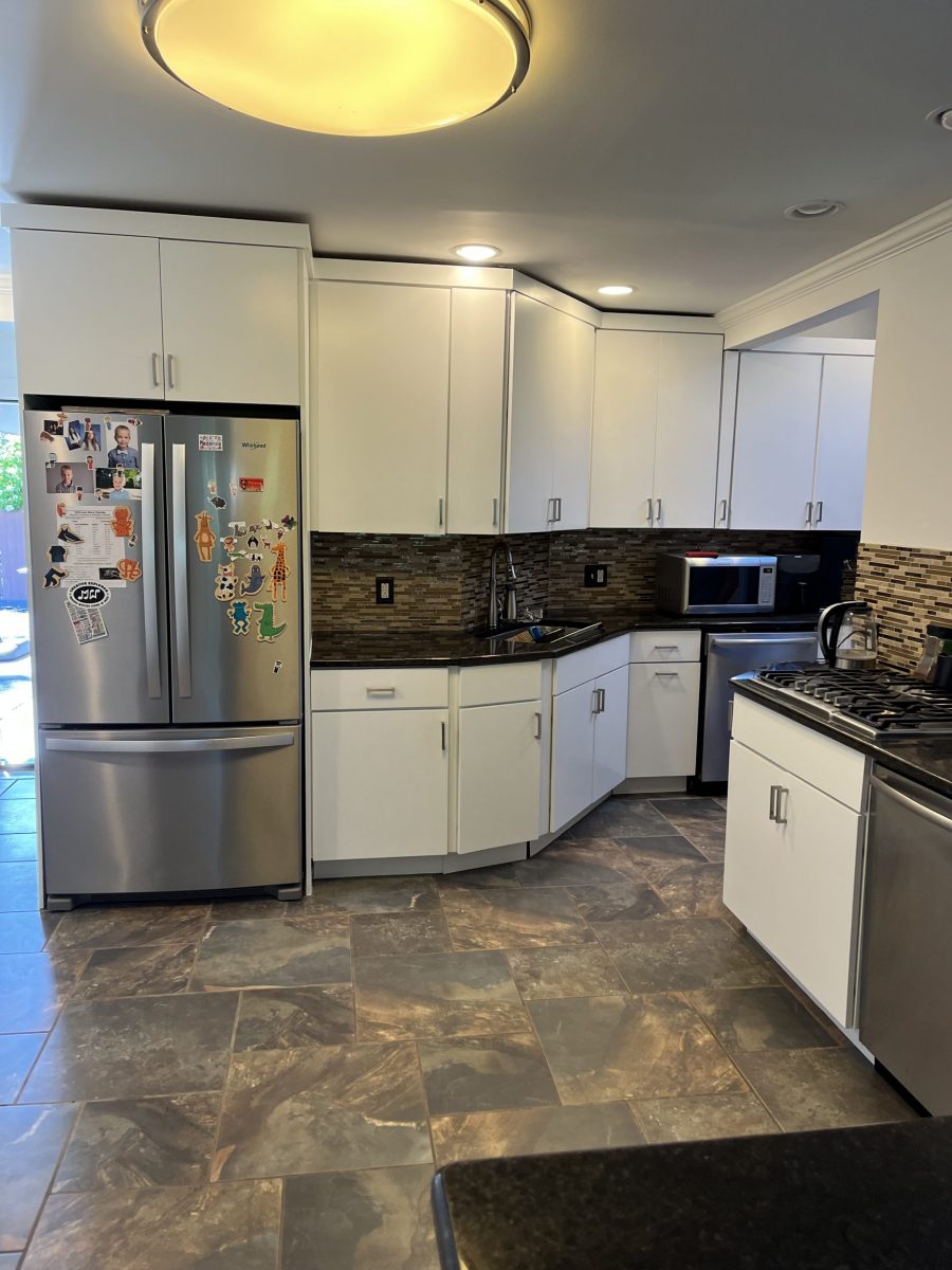 white kitchen cabinets with black counter tops