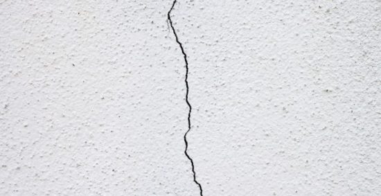 stucco damaged with a crack