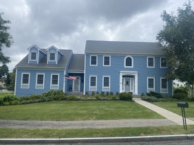 Blue home in Beverly, MA after completed residential exterior painting project by certapro painters of north shore and cape ann
