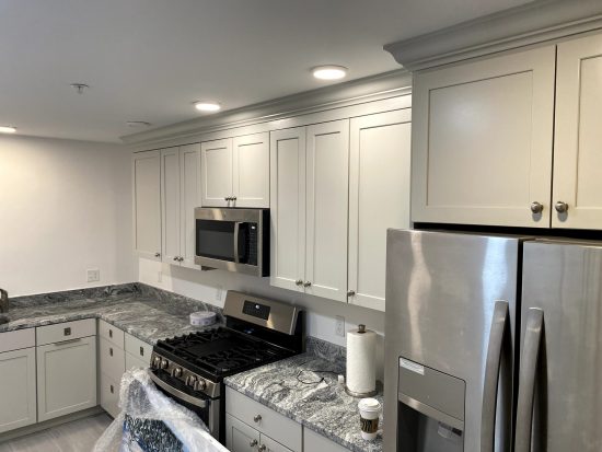 Kitchen Cabinets in Gloucester, MA, after completed crown molding by certapro painters of north shore and cape ann