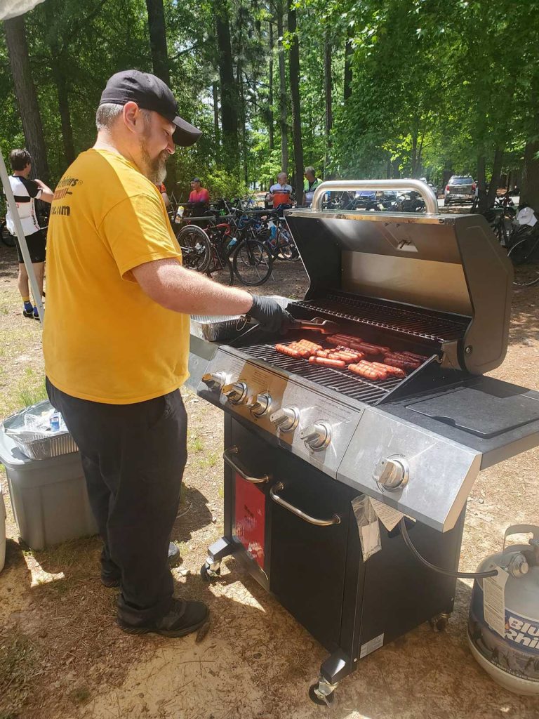 certapro staff grilling hot dogs