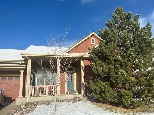 front of house with porch and tree Preview Image 3