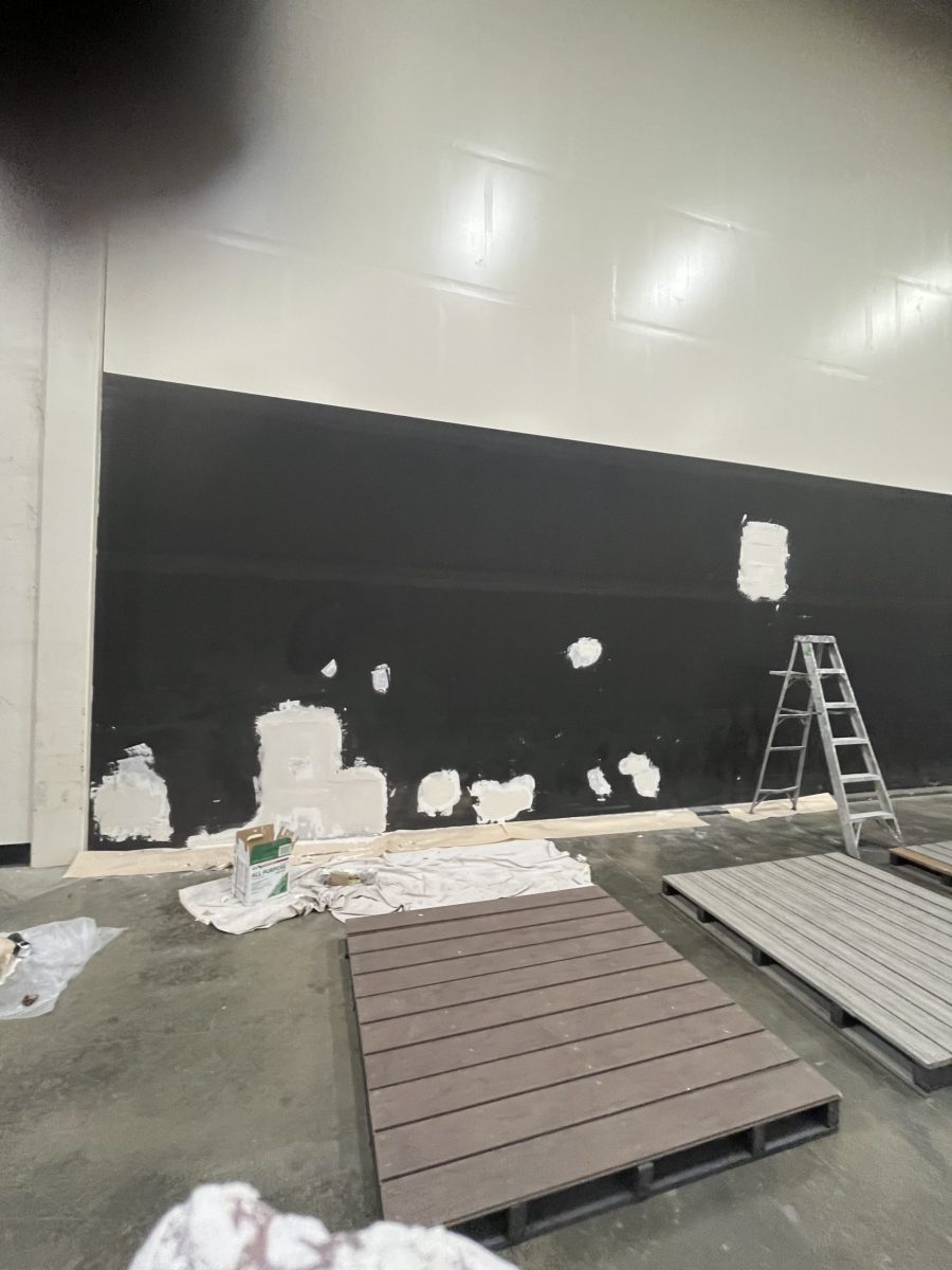 black warehouse wall with drywall damage Preview Image 3