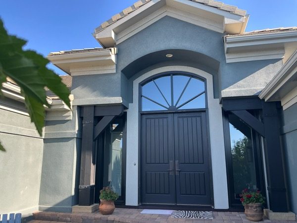 front entrance of blue painted stucco house Preview Image 1