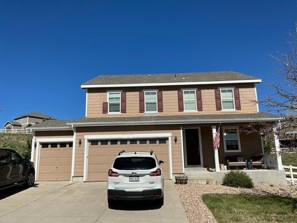 front of house with brown siding before repaint Preview Image 2