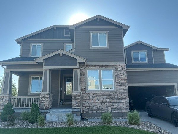 front of house with stone and repainted siding Preview Image 1