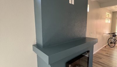 blue painted mantle in home