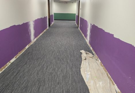 hallway with purple lower section