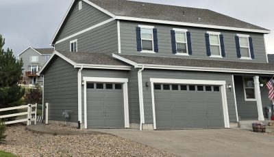 front of house with grey painted siding