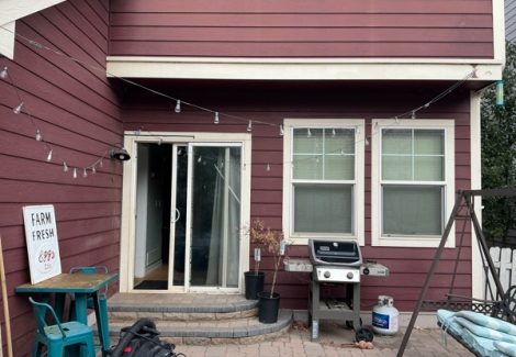 house exterior with marroon siding and white trim