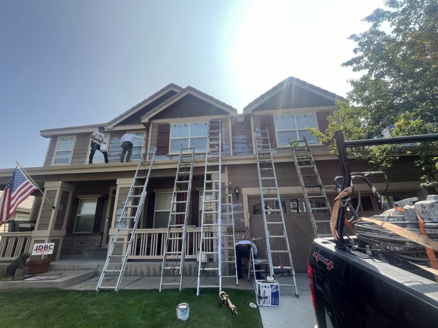 ladders leaning against house for painting project Preview Image 6