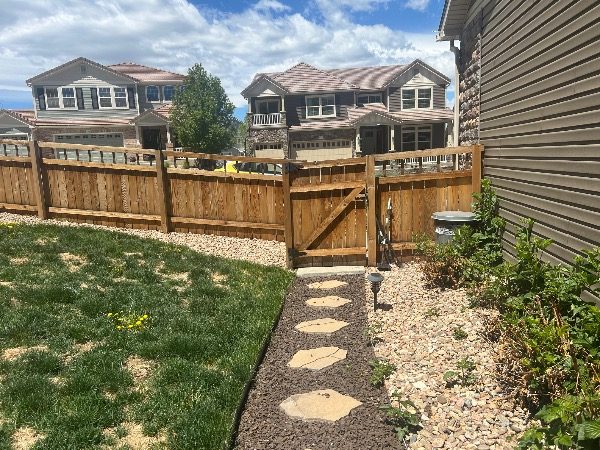 unpainted fence surrounding house Preview Image 4