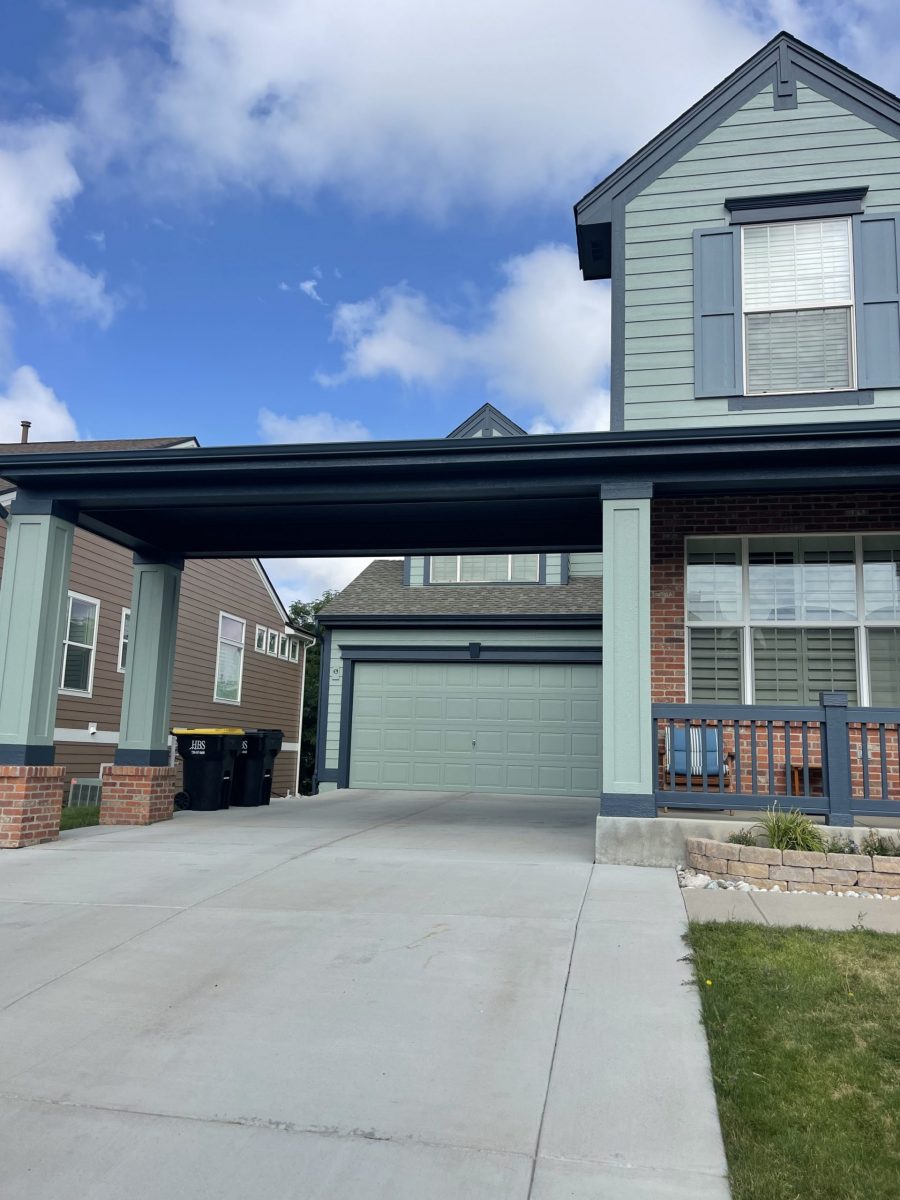 painted house exterior with light seafoam green siding and navy trim Preview Image 1