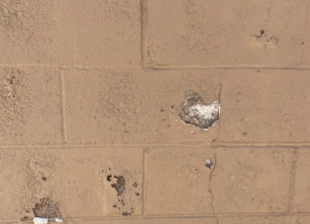 damaged masonry on mall exterior