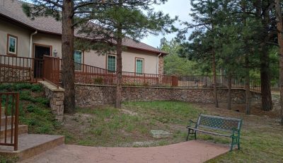 house exterior with wrought iron fence