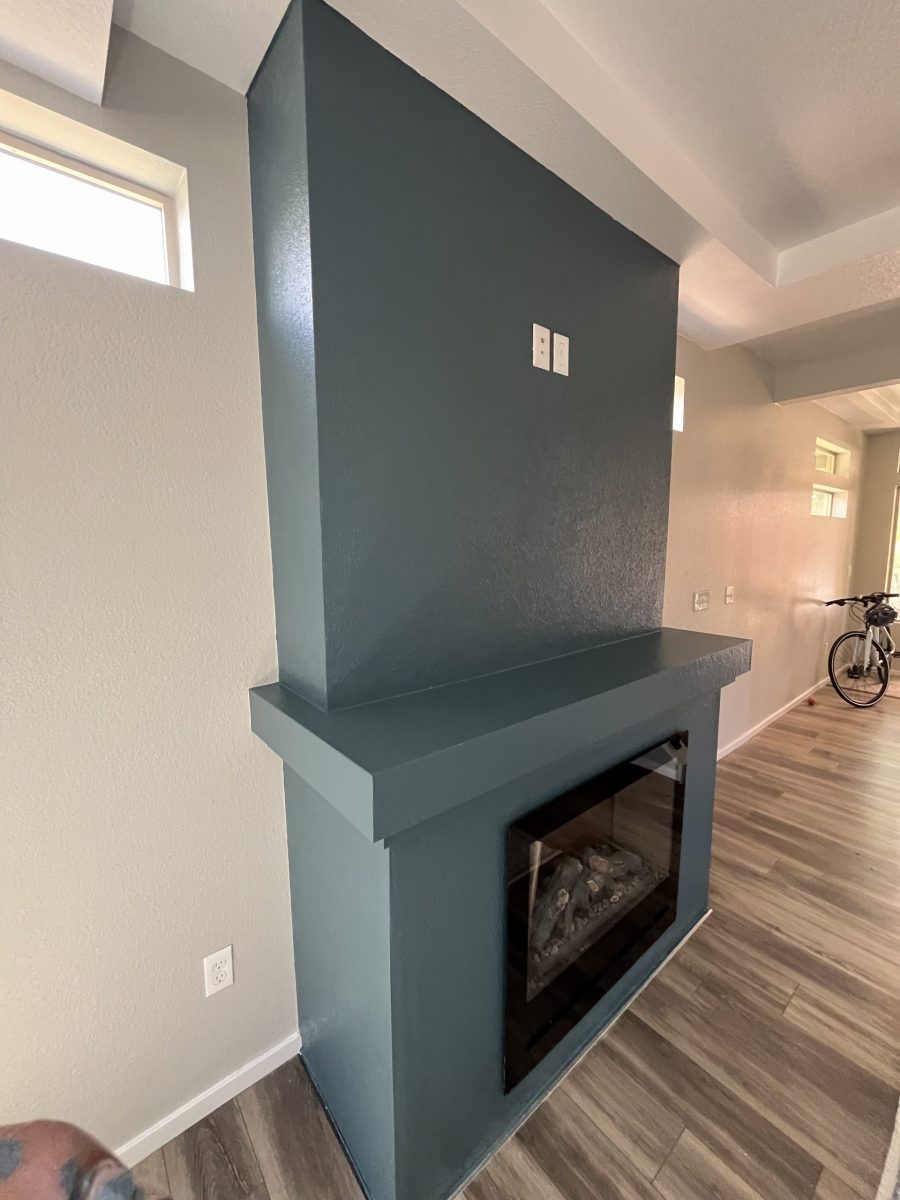blue painted mantle in home