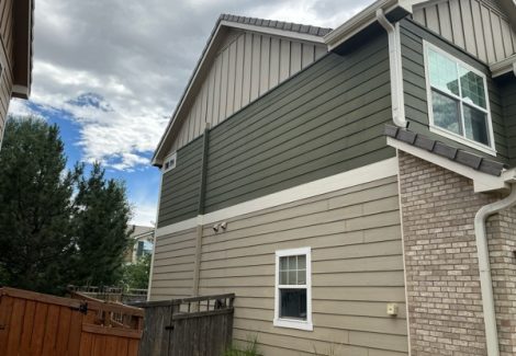 side of home with two tone color siding