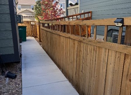 wooden fence surrounding house before restain