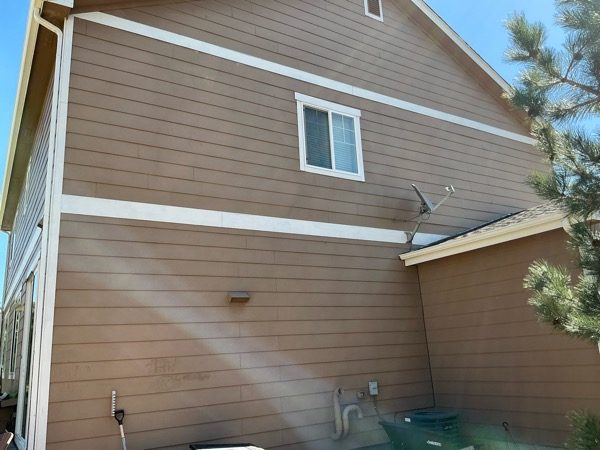 side of house with worn brown siding Preview Image 3