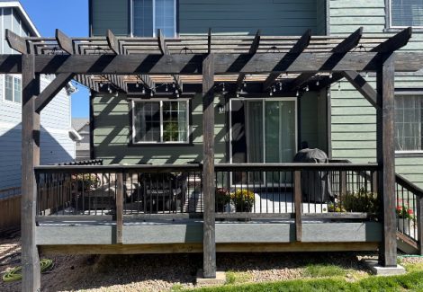 wooden pergola with worn stain