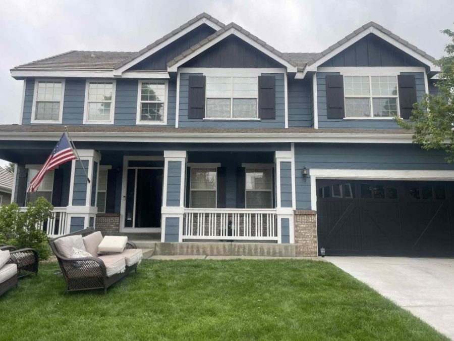 front of house with blue painted siding and white trim
