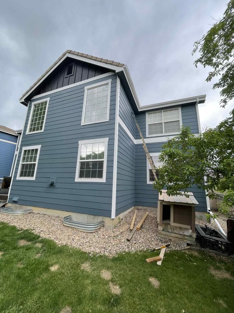 back side of house with blue painted siding Preview Image 2