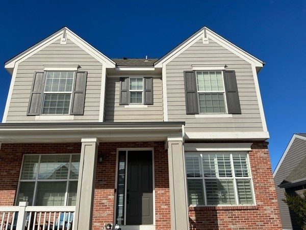 house with brick and tan siding and white trim Preview Image 8