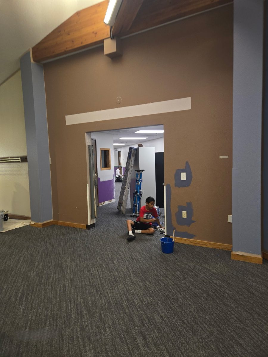 man sitting in hallway painting wall Preview Image 6