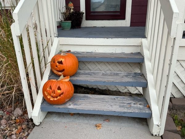 wooden porch steps with worn paint and jackolanterns Preview Image 9