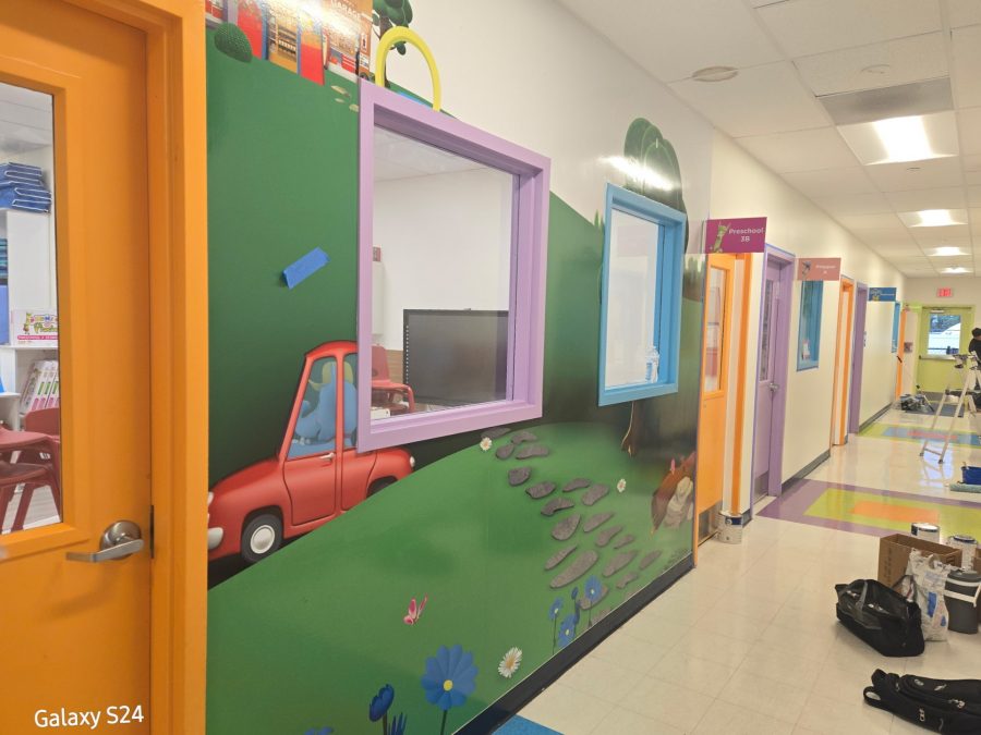 preschool hallway with colorfully painted classroom doors Preview Image 8