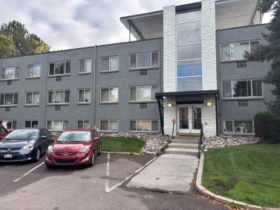 grey painted multi-unit housing buidling exterior