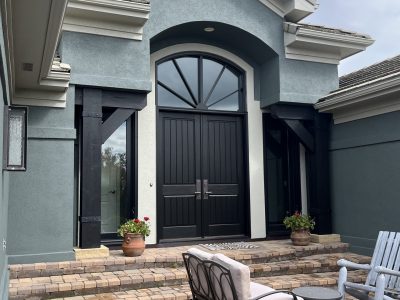 front entrance of blue painted stucco house