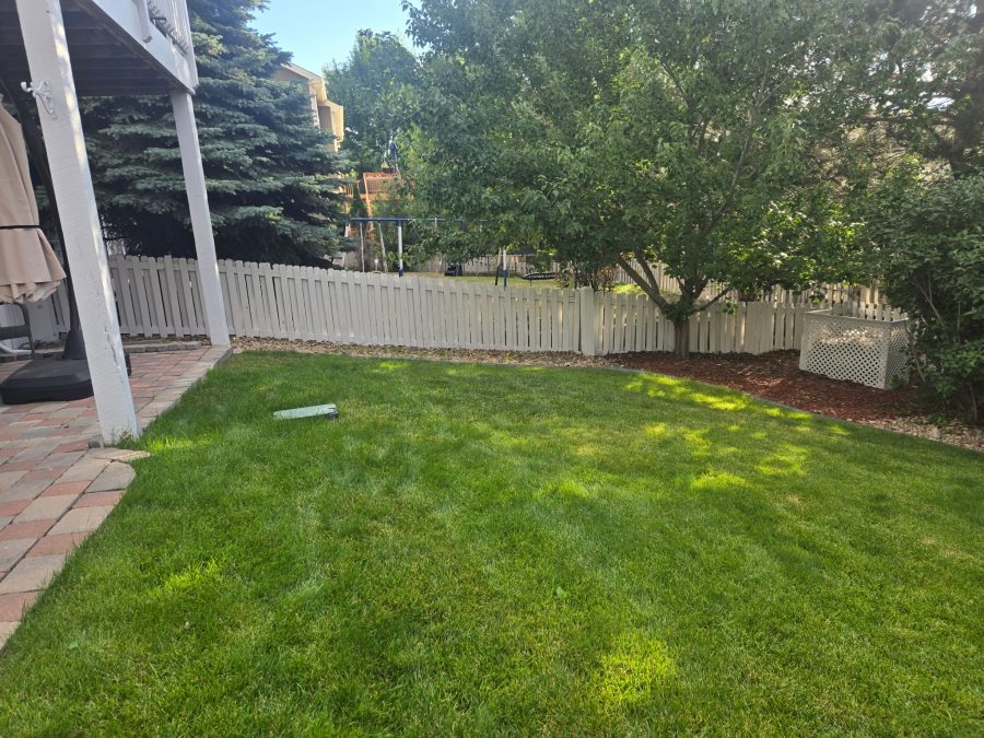 repainted white picket fence surrounding yard Preview Image 3