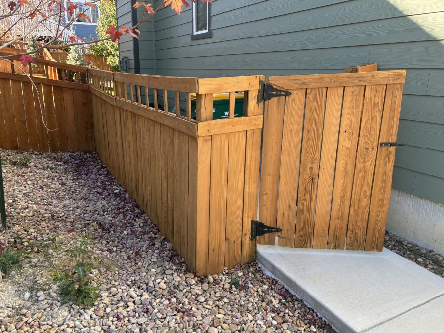 stained wooden fence surrounding house Preview Image 1