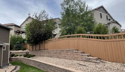 painted fence surrounding house