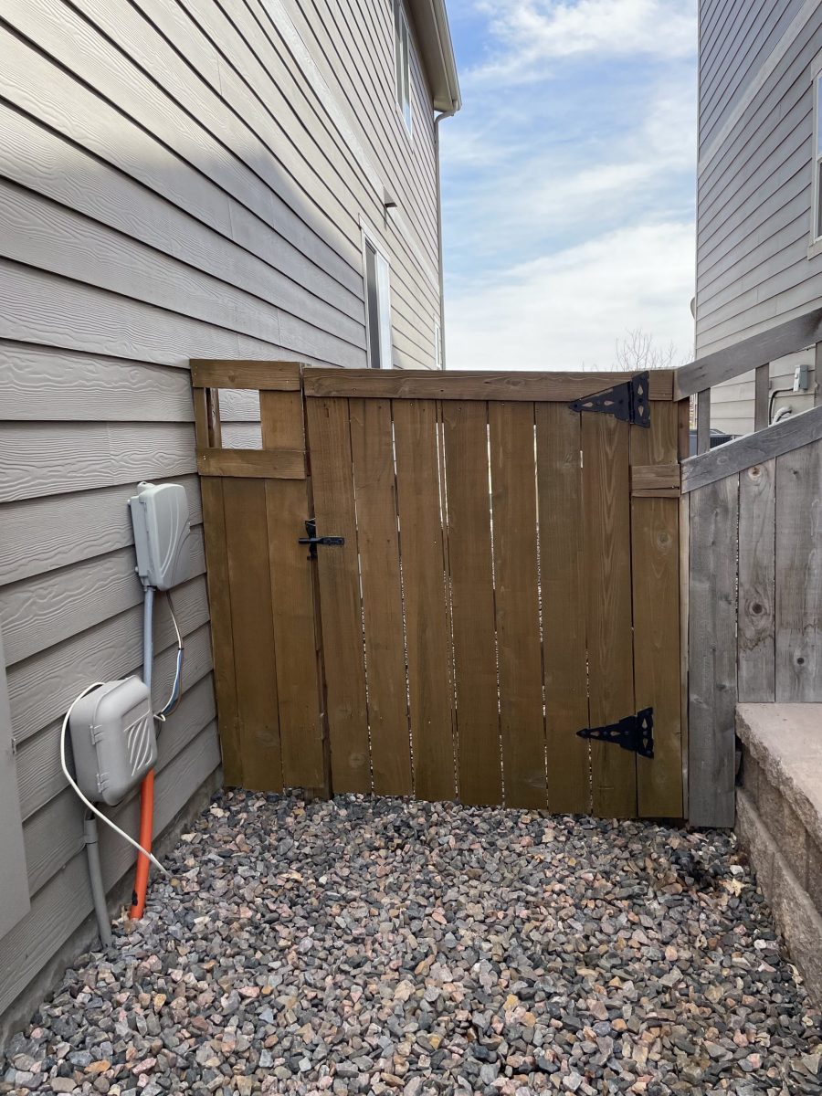 stained wooden fence gate