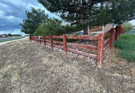 split rail fence with damaged paint