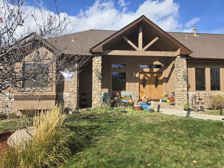 front exterior of stucco home after repaint