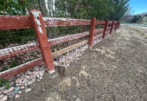 split rail fence with damaged paint