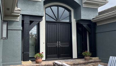 front entrance of blue painted stucco house