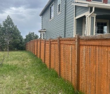 worn stained wooden fence