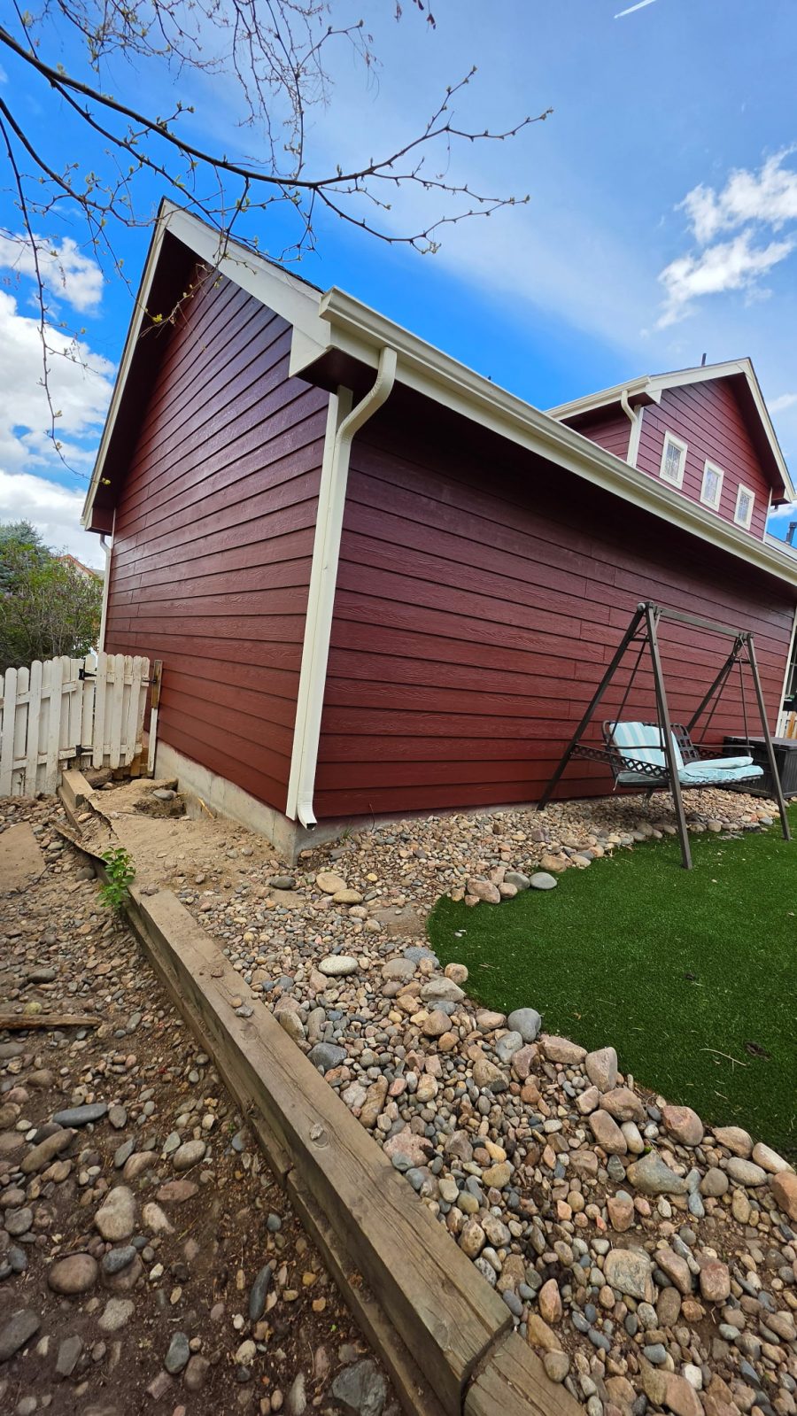 exterior siding of house painted dark red Preview Image 2