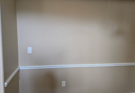 painted interior room with wood floor