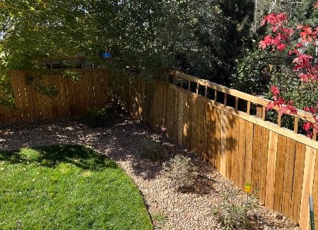 wooden fence surrounding house before restain