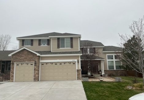 garage view of house and driveway before painting project